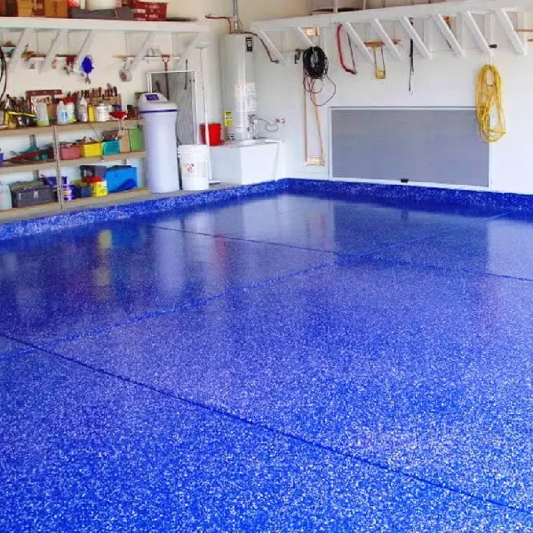 residential garage with a bright, vibrant blue epoxy floor speckled